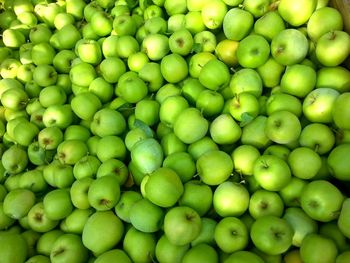 Full frame shot of granny smith apples for sale at market stall