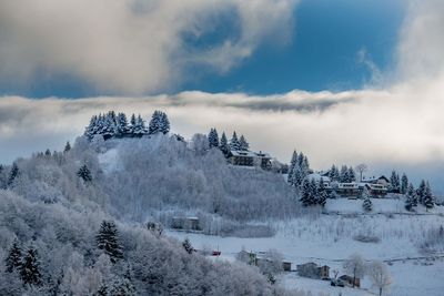 Scenic view of snow covered landscape against sky