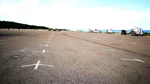 View of airplane on runway against sky