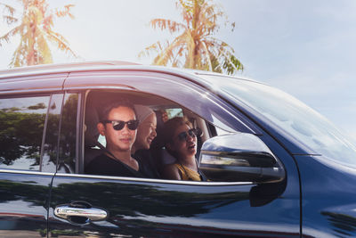 Portrait of young woman in car