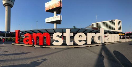 Information sign on street against clear sky