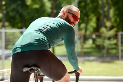 Side view of man exercising in park