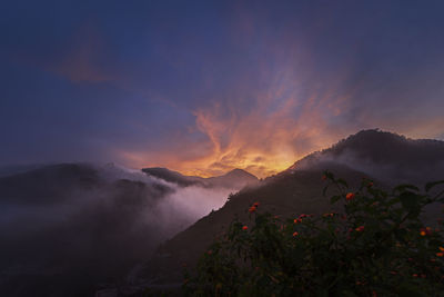 Scenic view of mountains against sky during sunset