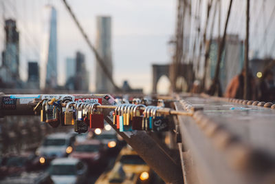 Close-up of padlocks on railing in new york city