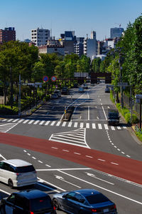 Vehicles on road along buildings