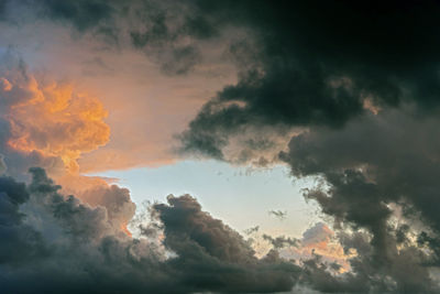 Low angle view of dramatic sky during sunset