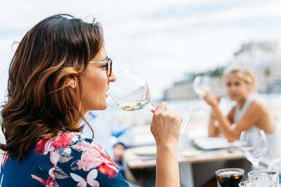 Portrait of a woman drinking water