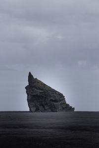 Rock formations on land against sky