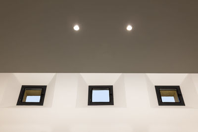 Low angle view of illuminated building against sky at night