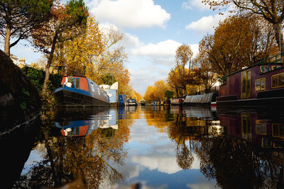 Reflection of trees in lake against sky during autumn