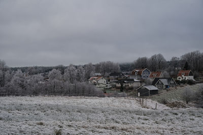 Scenic view of field against sky during winter