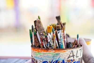 Close-up of multi colored pencils in container