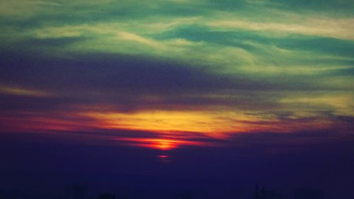 Low angle view of dramatic sky during sunset