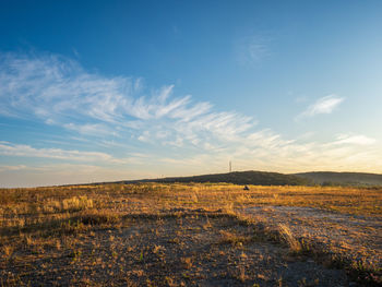 Autumn landscape. high blue sky with clouds on a deserted clearing covered