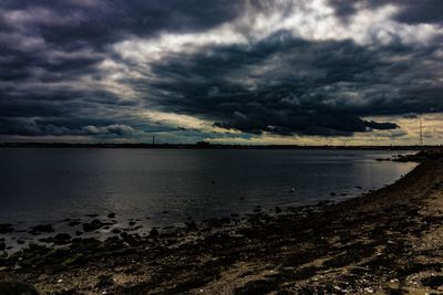 Scenic view of sea against cloudy sky