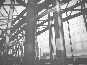 Low angle view of man on bridge against sky