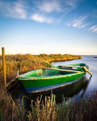 Small wooden fisherman boat between salicornia. long exposure, saltwort, cagliari, sardinia