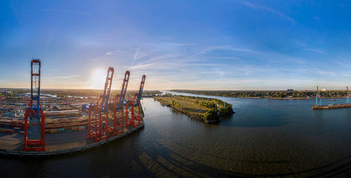 Aerial view of a container terminal in the port of hamburg at sunset