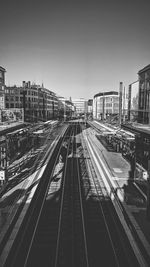 High angle view of railroad tracks in city against clear sky