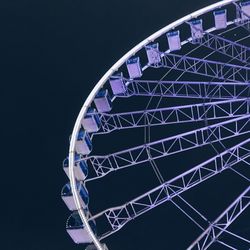 Low angle view of ferris wheel against sky at night