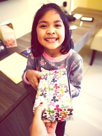 Portrait of a smiling girl at home