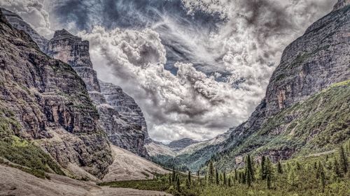 Scenic view of mountains against cloudy sky