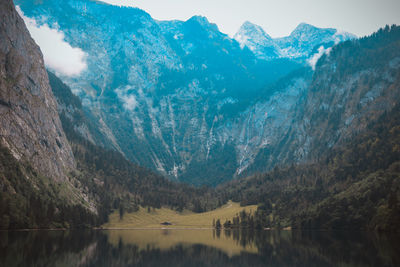 Scenic view of lake and mountains against sky