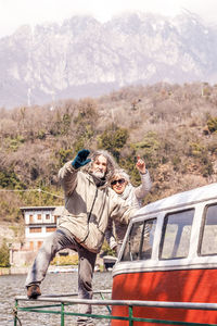 People on mountain road against mountains