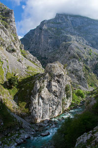 Scenic view of rocky mountains against sky, picos de europa