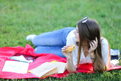 Woman lying on field