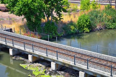 High angle view of bridge over river by trees