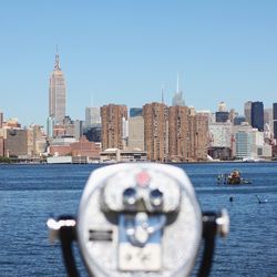 View of cityscape against blue sky