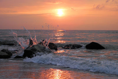 Scenic view of sea against sky during sunset