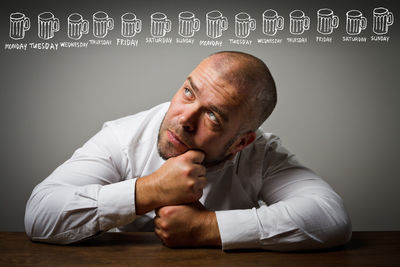 Portrait of a man sitting on table