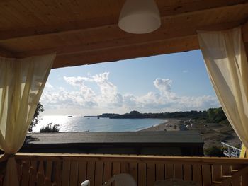 Scenic view of sea seen through window