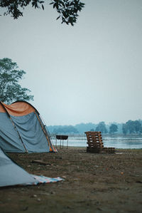 View of tent on beach against clear sky