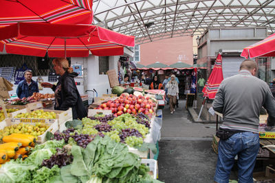People at market stall
