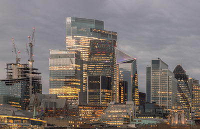 Illuminated buildings in city at night