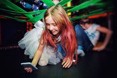 Girl with long hair using phone