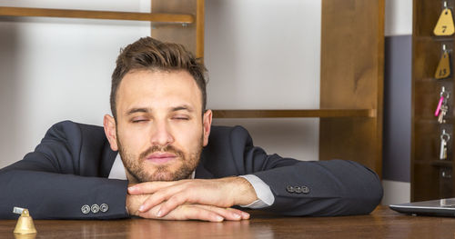 Portrait of a man sitting on table