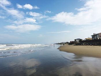 Scenic view of sea against cloudy sky