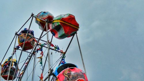 Low angle view of multi colored umbrella against clear sky