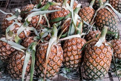 Close-up of pineapples at market stall