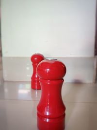 Close-up of red wine bottle on table