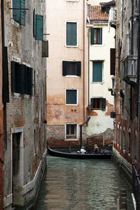 Canal amidst buildings