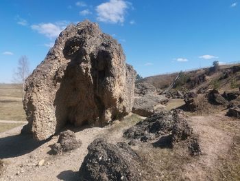 Panoramic view of rock formation on land against sky