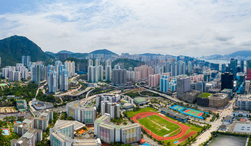 High angle view of buildings in city against sky