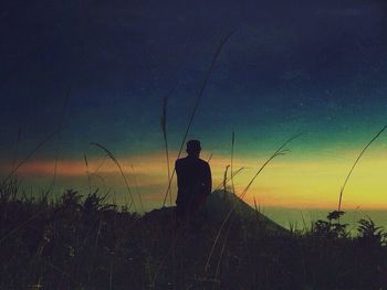 Silhouette of woman at sunset