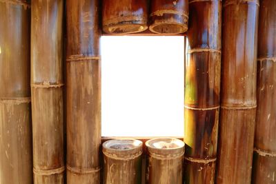 Close-up of beer glass on wooden window