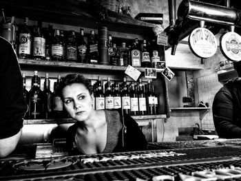 Portrait of young woman in store